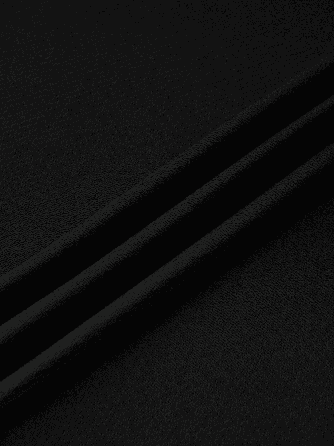 Close-up of black VEFORE fabric texture